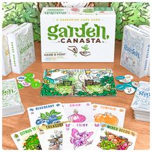 Load image into Gallery viewer, Garden Canasta's game box, deck boxes, cards, tokens and board spread out on a table